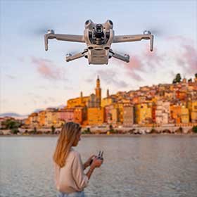 DJI drone flying above a waterfront