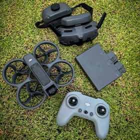 DJI drone kit and controller on grass